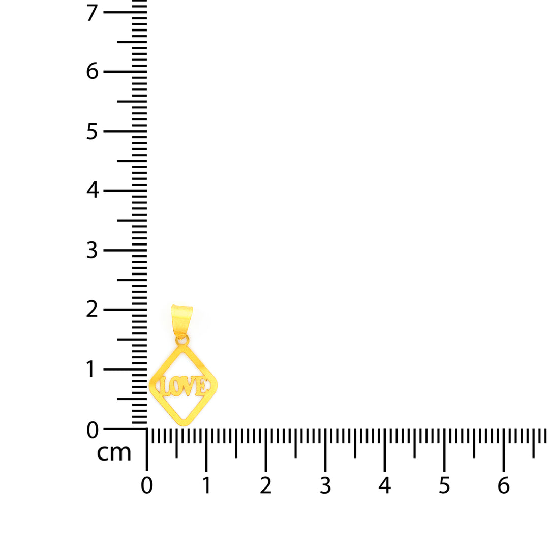 Gold pendant with 'LOVE' engraving next to a ruler on a white background