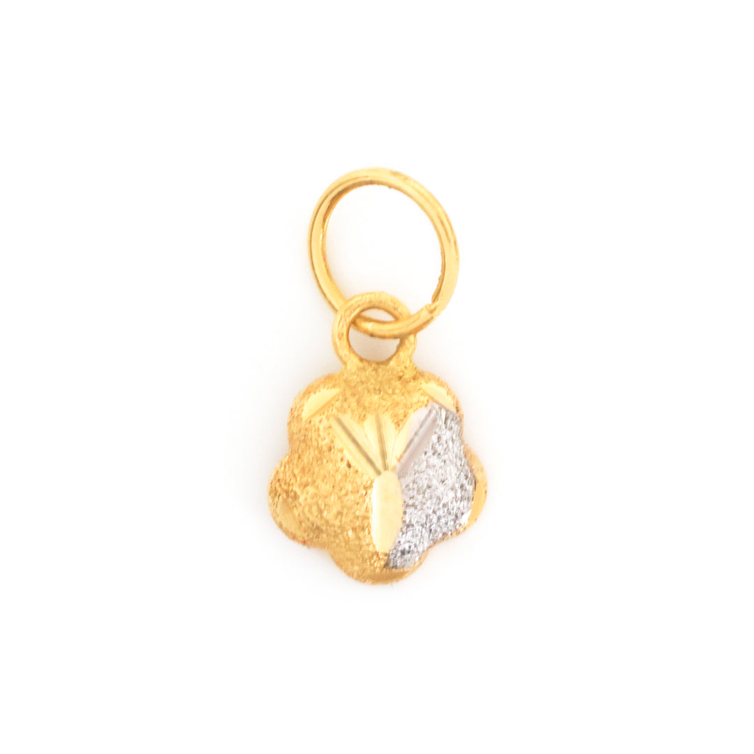 A small gold charm pendant with a textured finish, featuring a half-gold, half-silver split design and a top loop, shown on a plain white background.