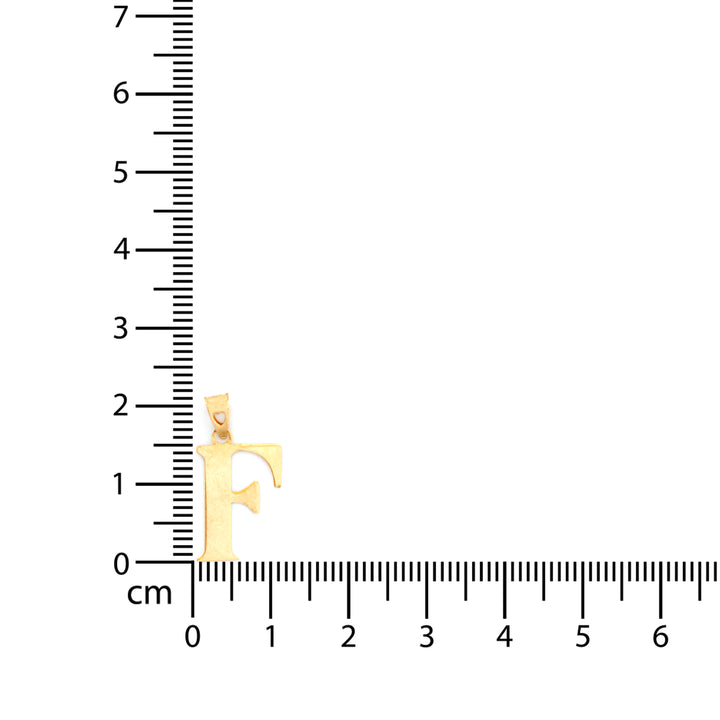 A gold initial pendant shaped like the letter 'F' is shown next to a centimeter ruler to indicate its size, on a plain white background.