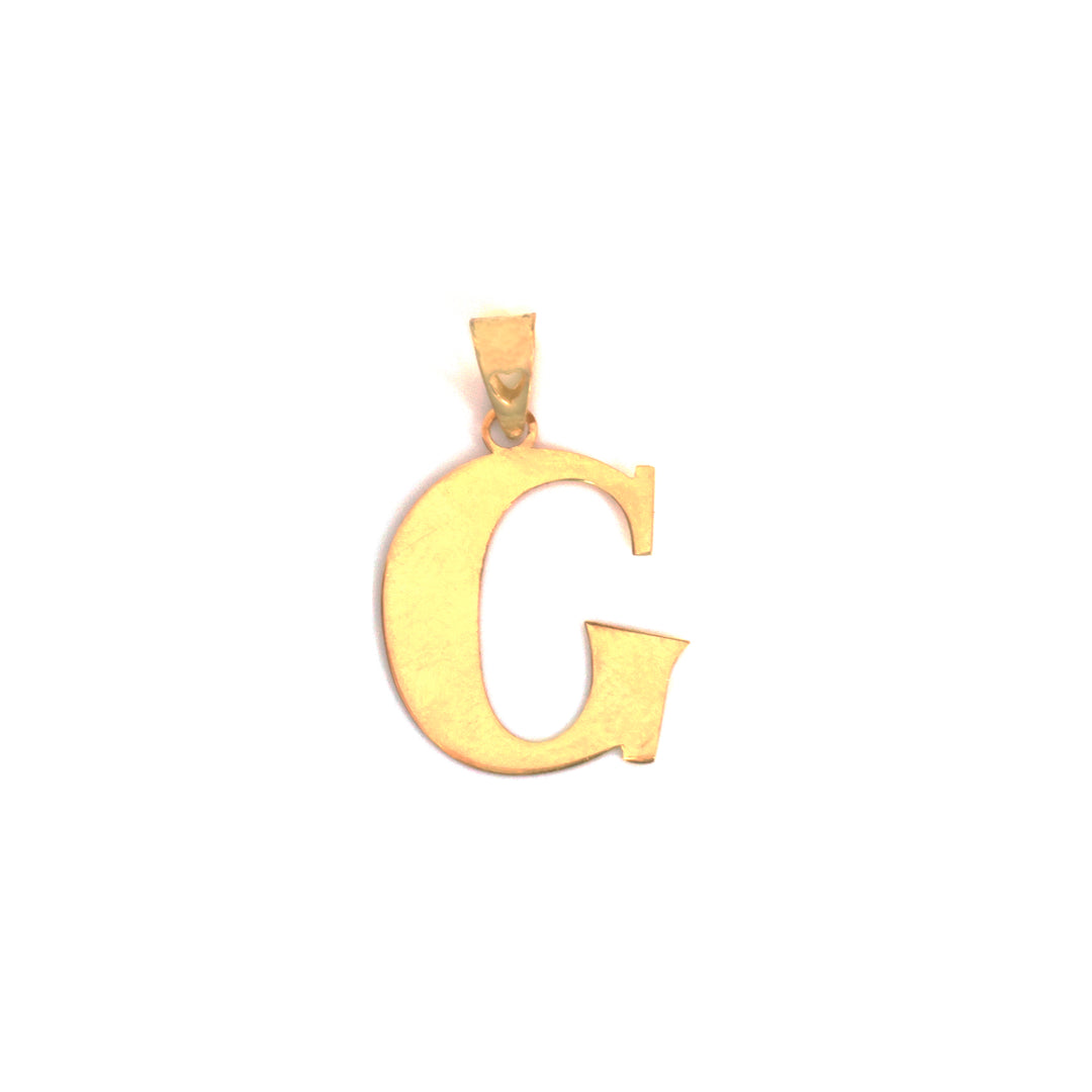 A gold initial pendant shaped like the letter &
