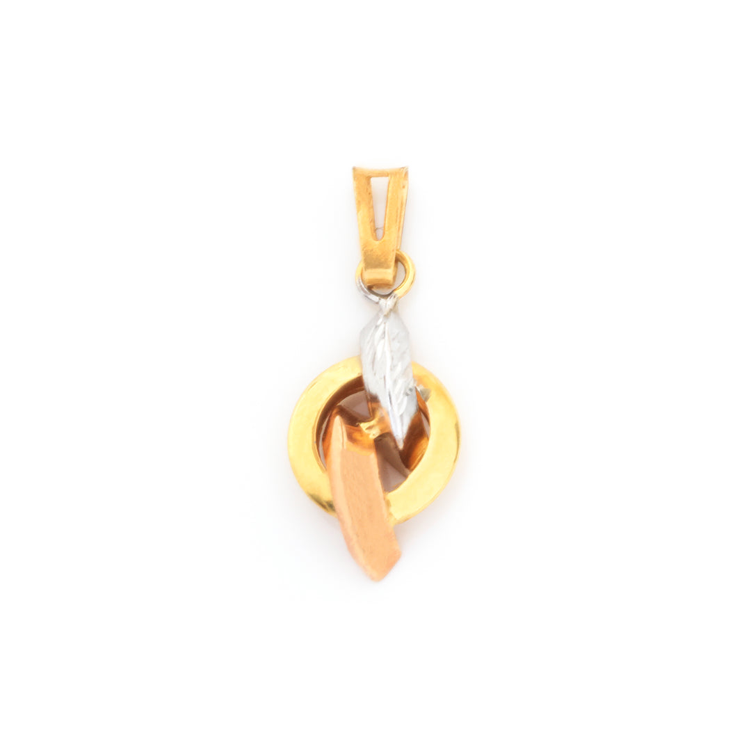 A gold pendant featuring a circular design with a textured silver leaf charm and a small rose gold accent, shown on a plain white background.