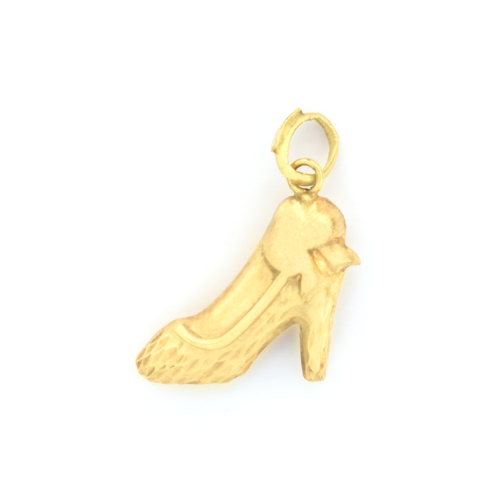A small gold charm shaped like a high-heeled shoe with a textured finish and a loop at the top, shown on a plain white background.