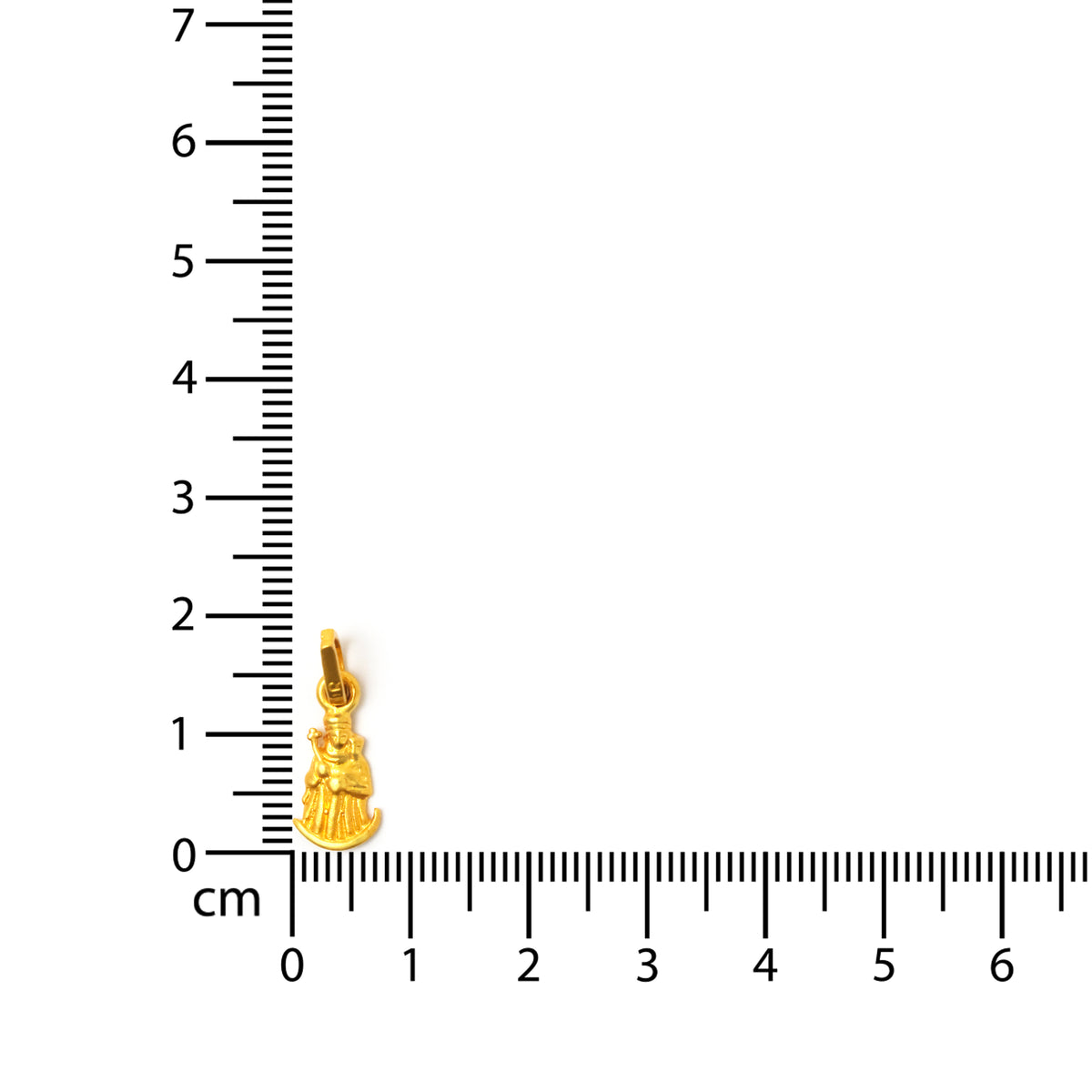 ذهب معلقة next إلى ruler on white background
