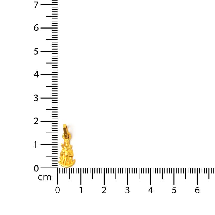 ذهب معلقة next إلى ruler on white background