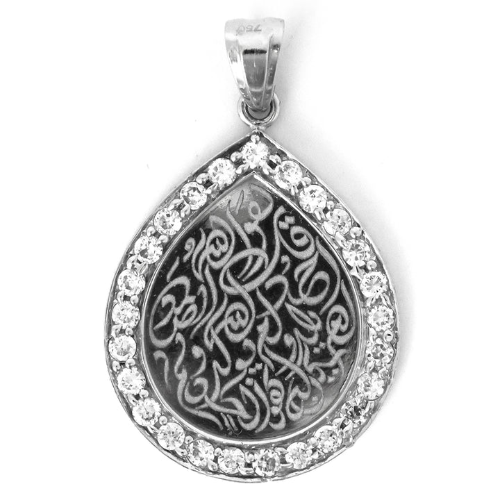 Teardrop-shaped pendant with intricate design and clear stones on a white background