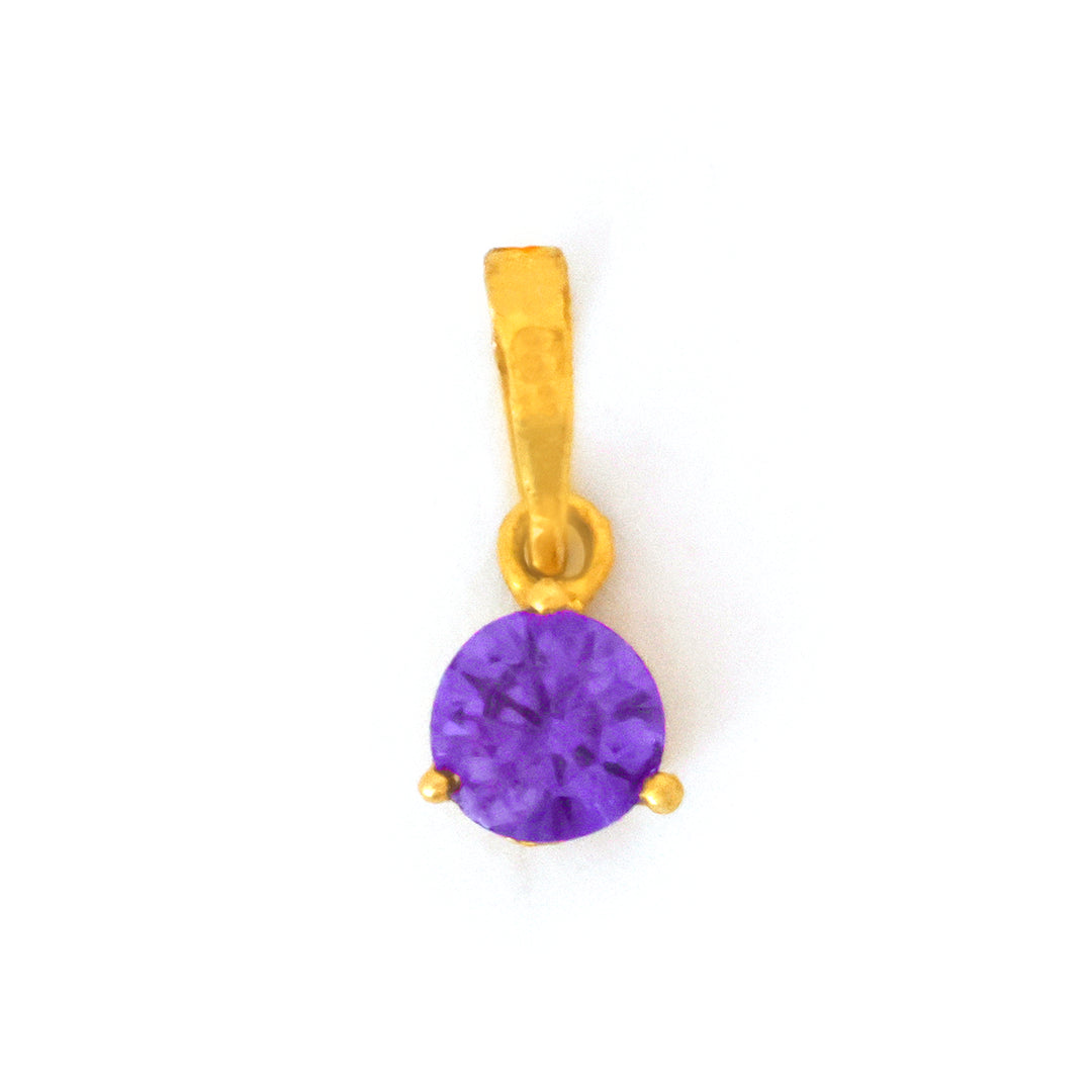 Gold pendant with a purple gemstone on a white background