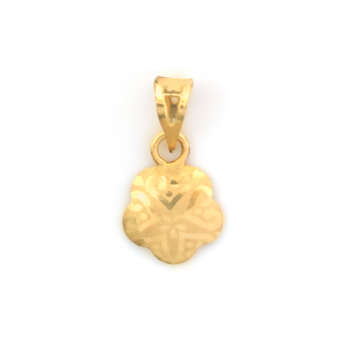 A small gold pendant with a floral or clover-like outline and engraved geometric patterns, shown on a plain white background.