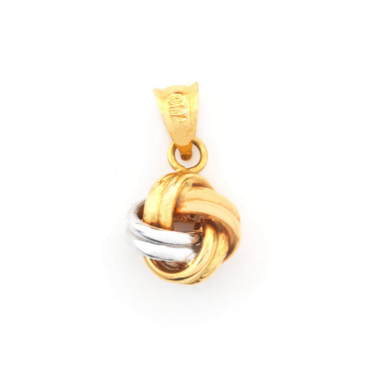 A two-tone gold and silver knot pendant on a white background.