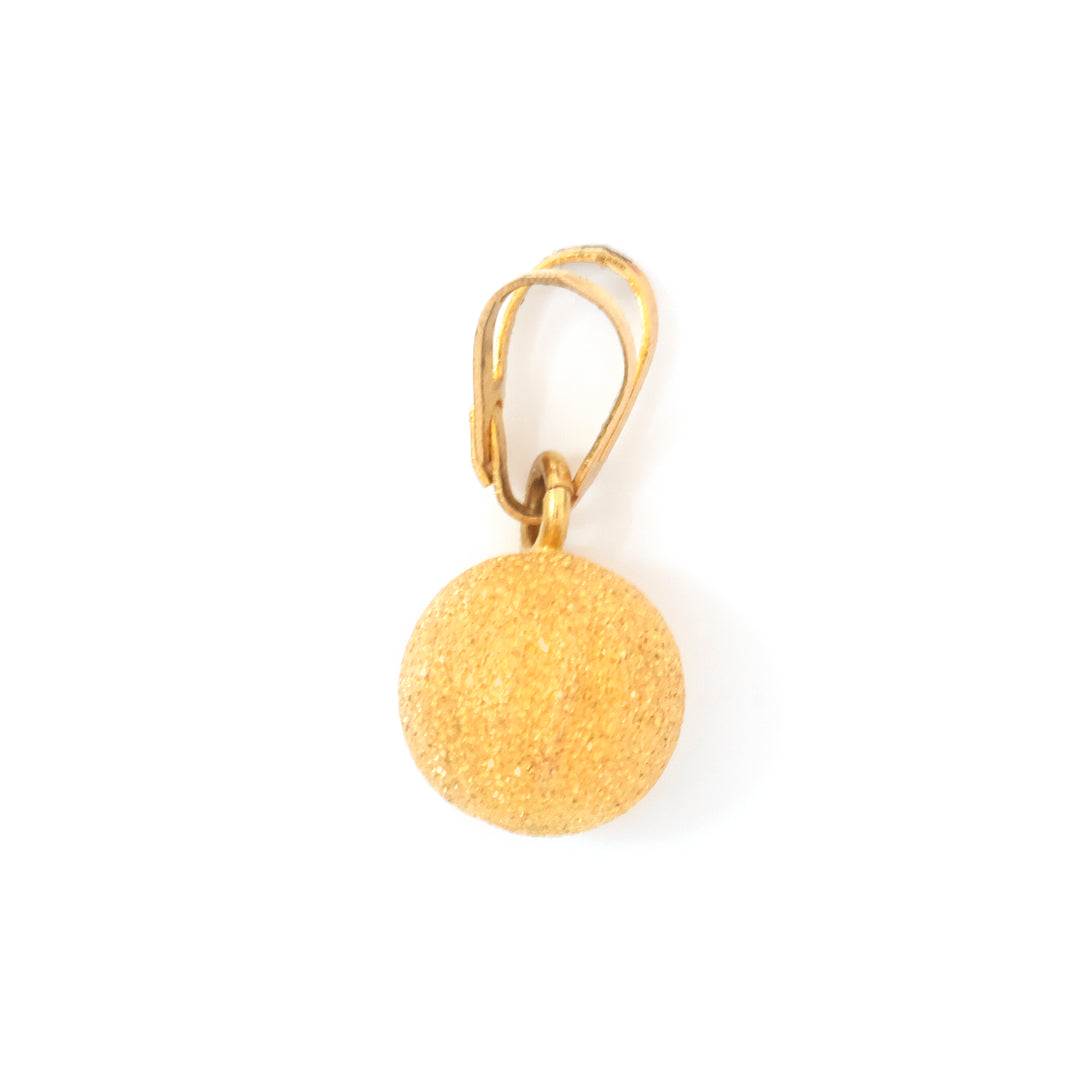 A gold leverback earring featuring a textured, glittery gold spherical drop charm, shown on a plain white background.