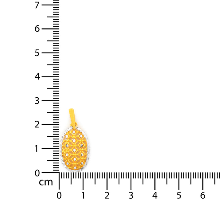 Gold pineapple-shaped pendant with embedded stones next to a ruler for scale on a white background