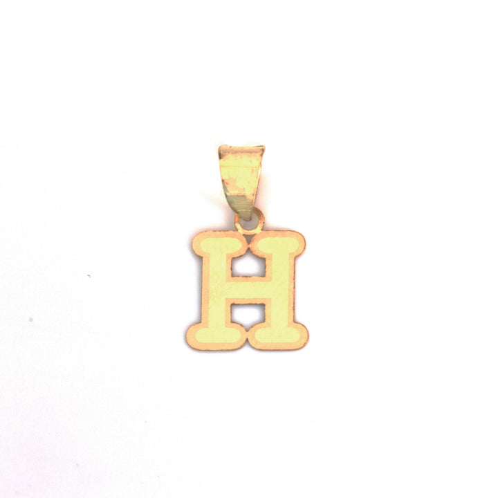 A gold initial pendant shaped like the letter &