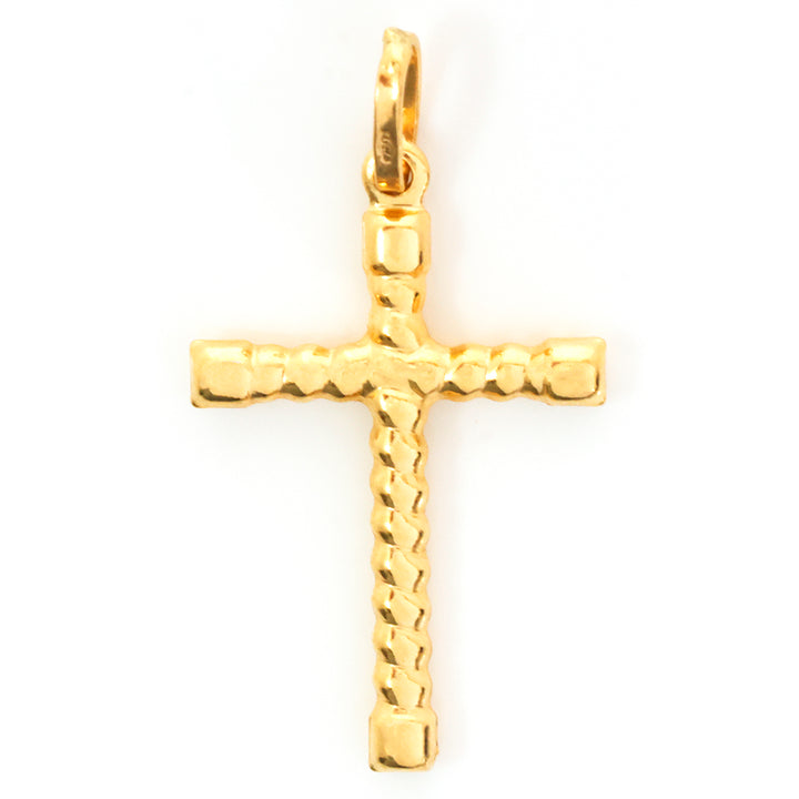 Gold cross pendant on a white background