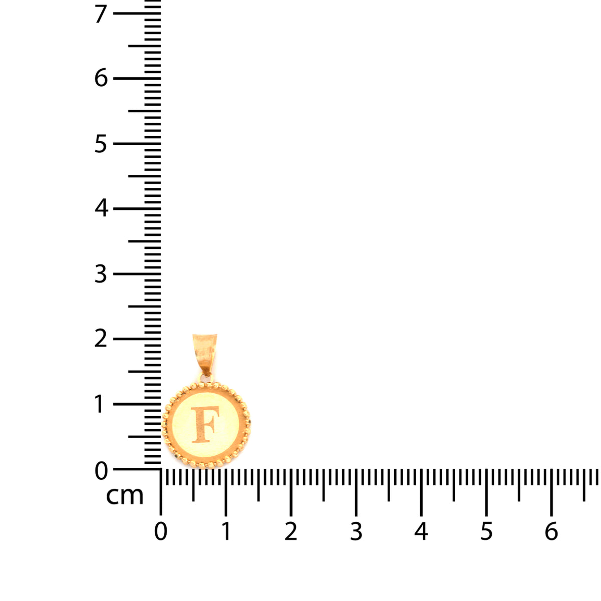 A gold initial pendant with the letter 'F' in the center, displayed next to a centimeter ruler to show its size.