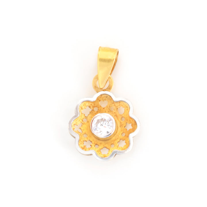 A gold and silver flower-shaped pendant with a single clear round-cut gemstone in the center, shown on a plain white background.