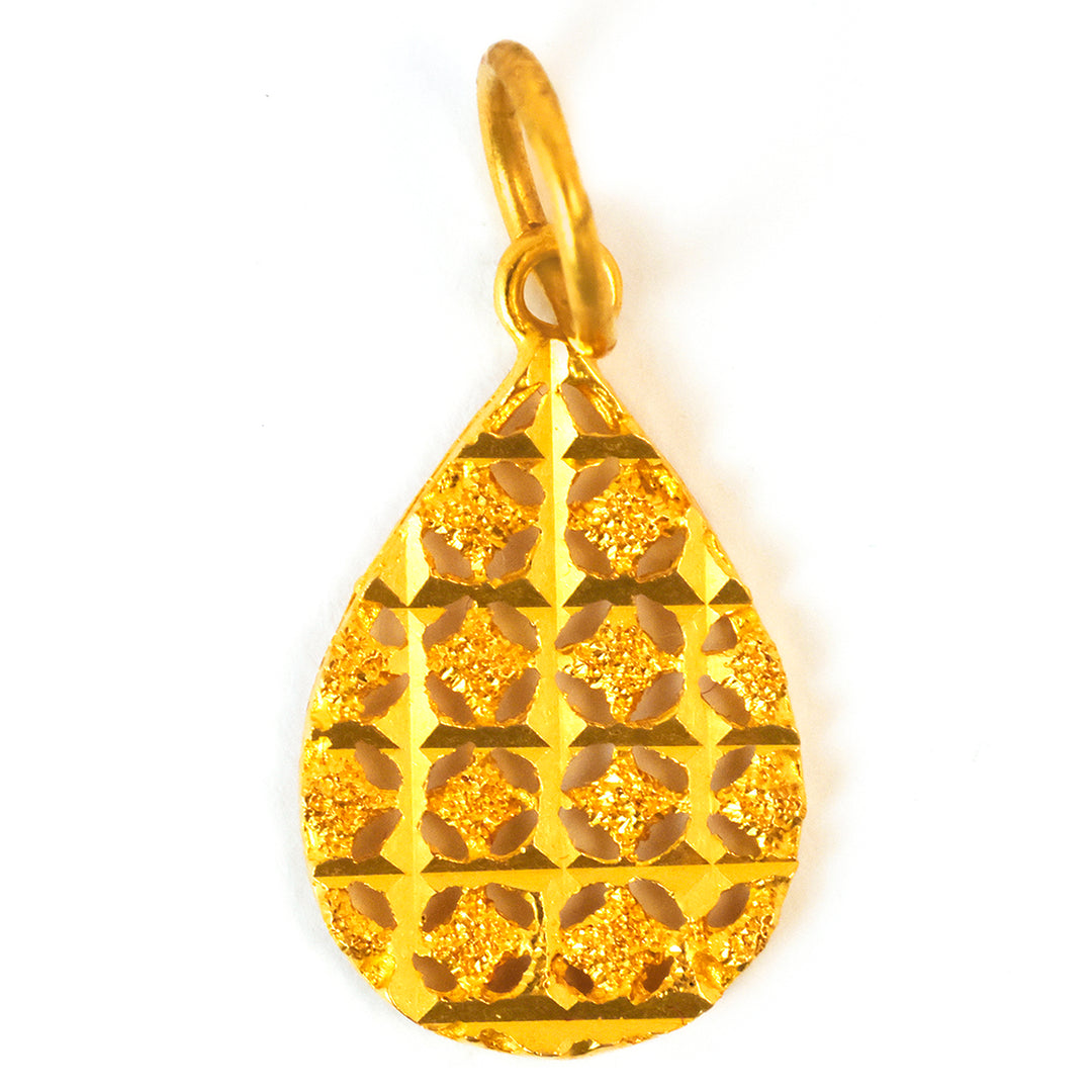 Gold teardrop-shaped pendant with intricate patterns on a white background
