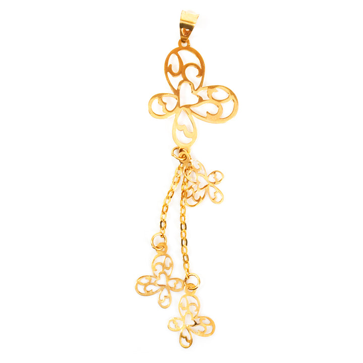 Gold pendant with intricate designs on a white background