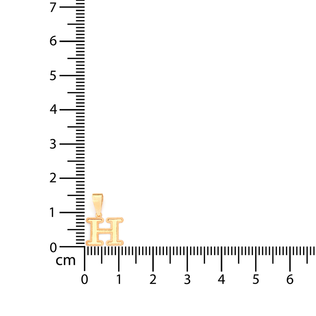 A small gold house-shaped pendant charm displayed next to a black centimeter ruler on a plain white background.