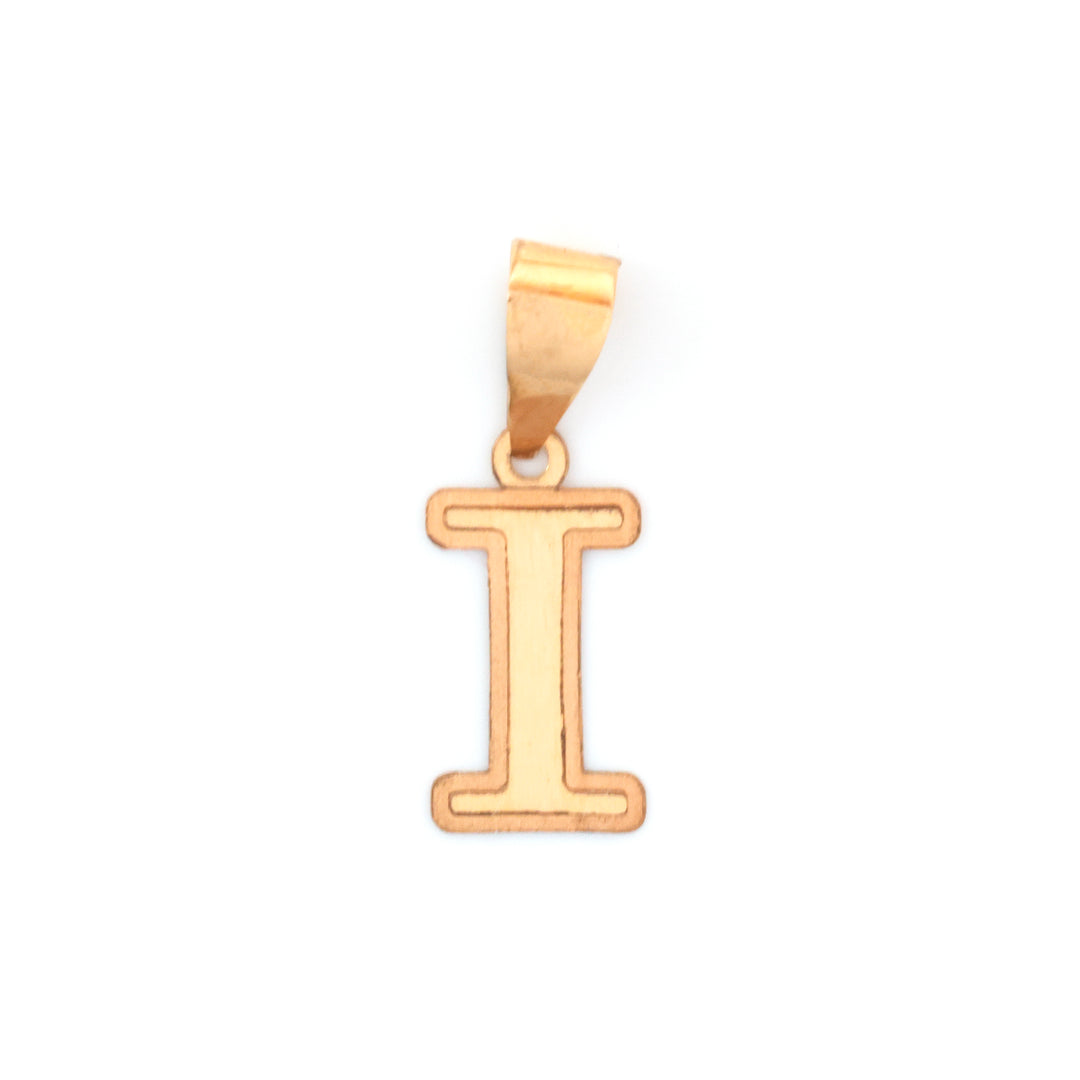 A gold initial pendant shaped like the letter &