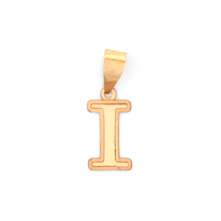 A gold initial pendant shaped like the letter &