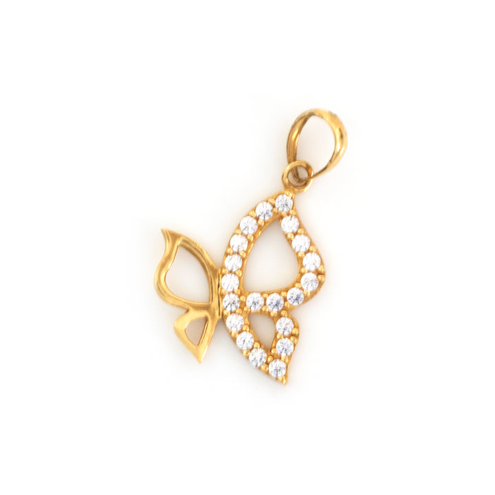 A gold pendant charm shaped like a butterfly with one wing paved with small clear stones and the other wing open, set against a plain white background.