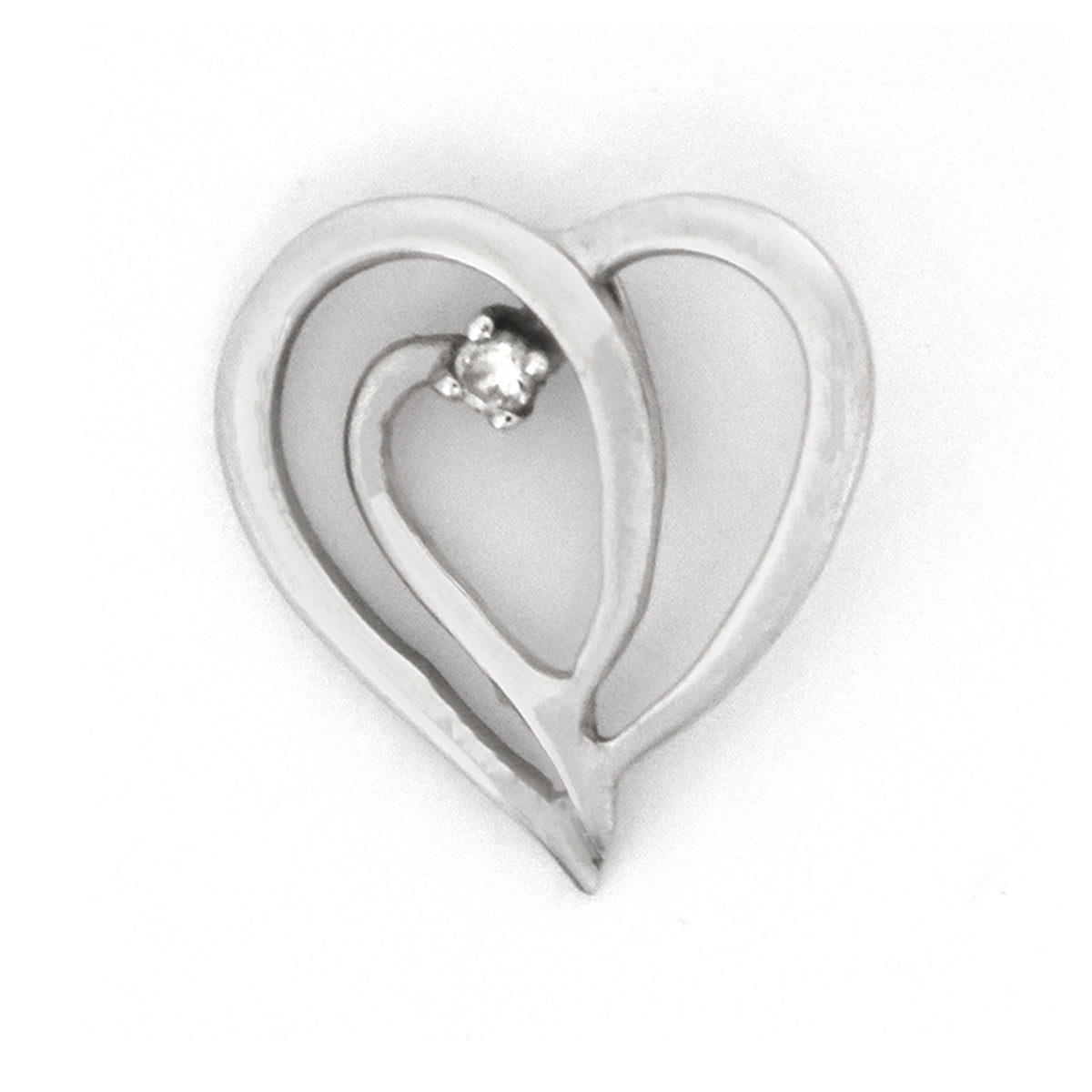 Silver heart-shaped pendant with a small diamond on a white background