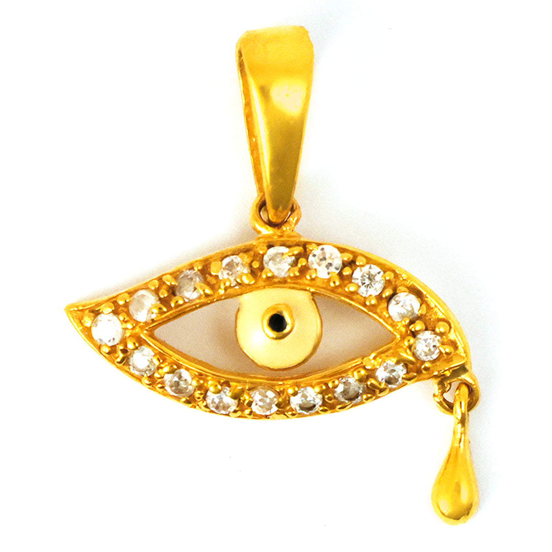 Gold pendant shaped like an eye with a tear, featuring embedded stones on a white background.