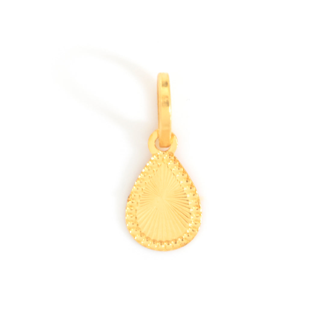 A gold teardrop-shaped pendant charm with a textured sunburst pattern and a beaded border, shown on a plain white background.