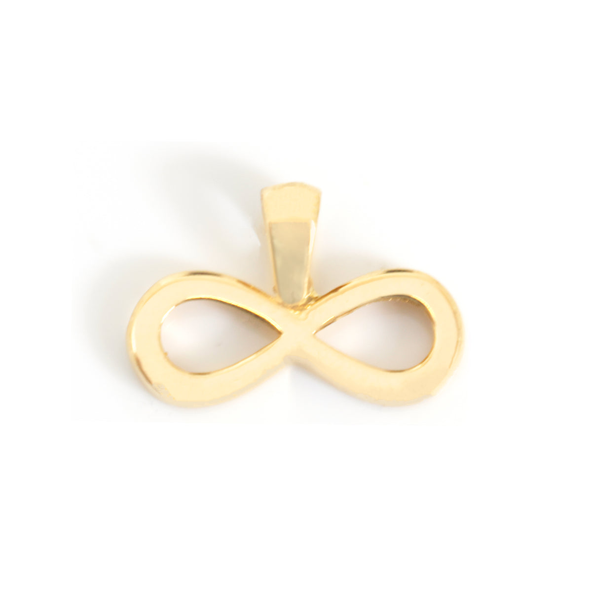 A polished gold infinity symbol pendant on a clean white background.