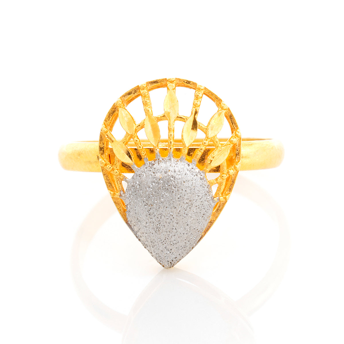 Gold ring with a textured heart-shaped stone on a white background