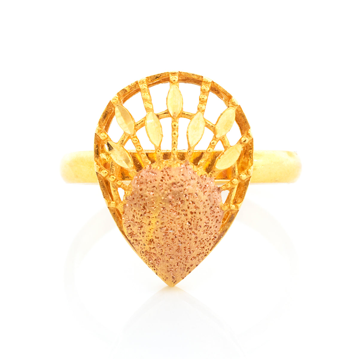 Gold ring with a textured heart-shaped stone on a white background