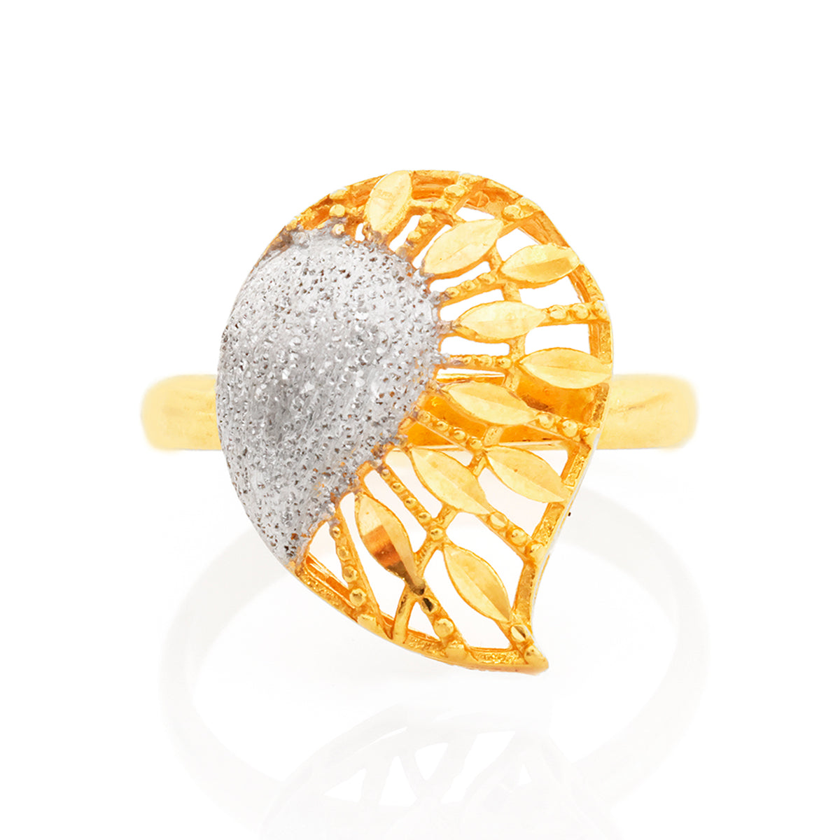 Gold and silver ring with leaf-like design on a white background