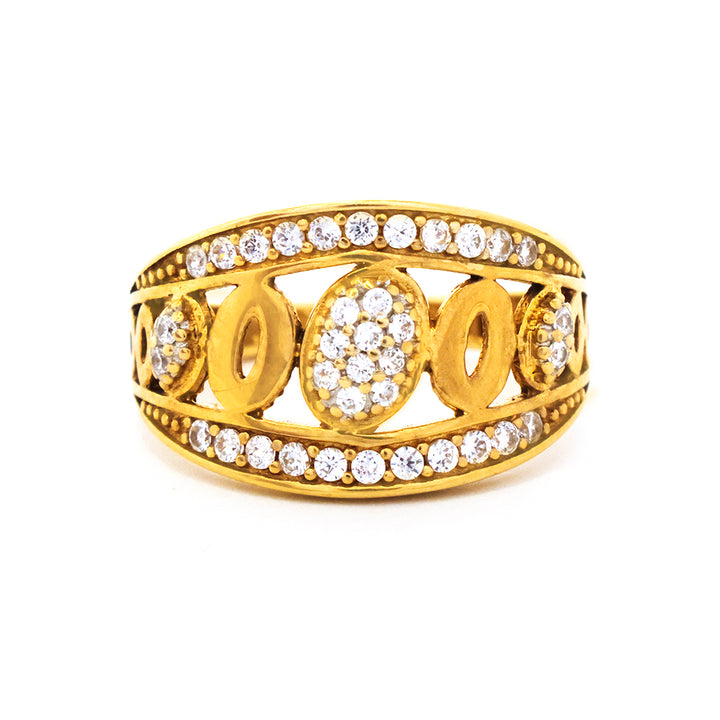 Gold ring with diamond accents on a white background