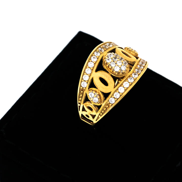 Gold ring with gemstones on a black cushion