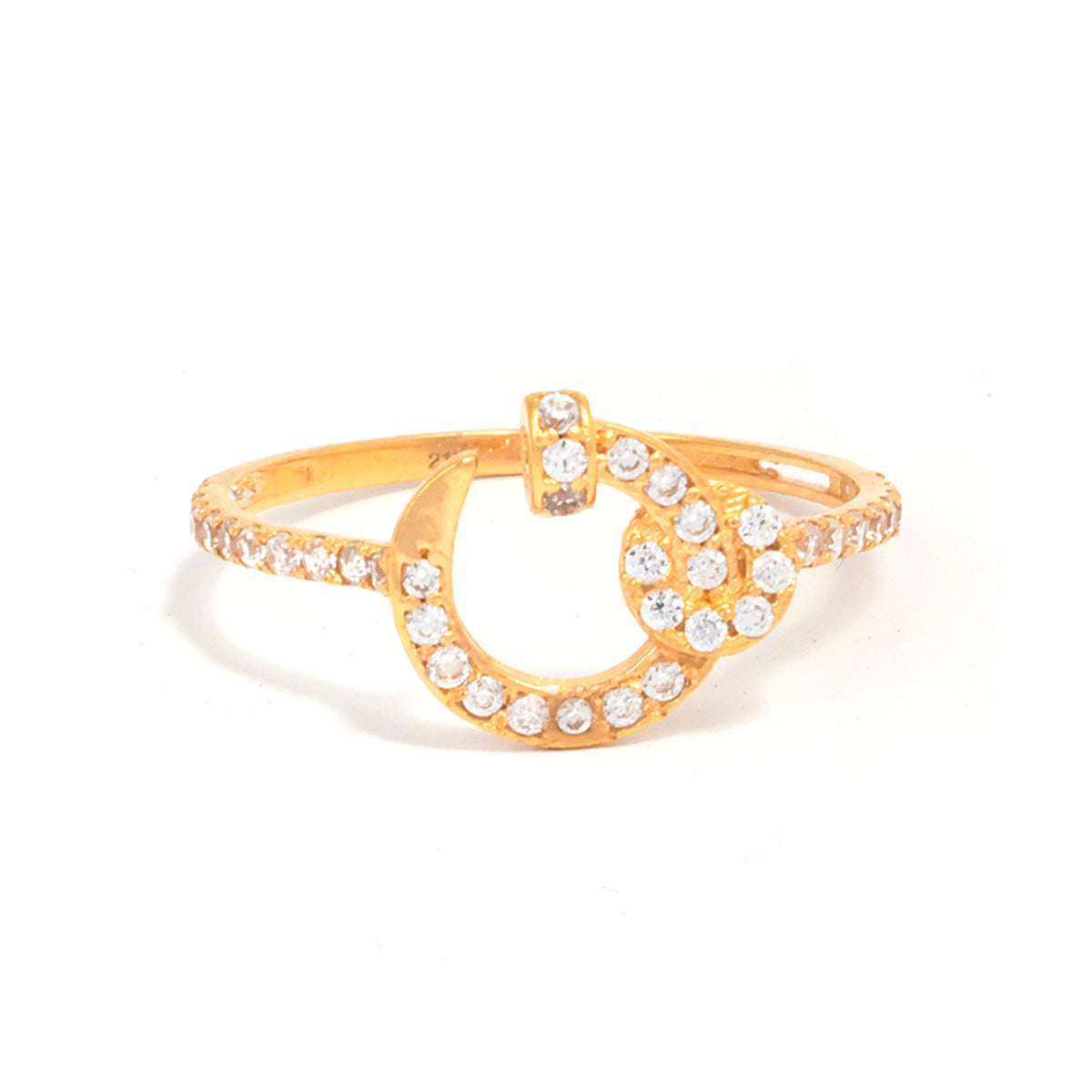 Gold ring with a horseshoe design and clear stones on a white background