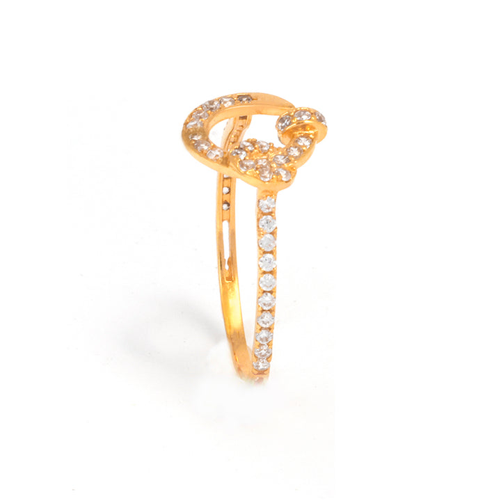 Gold ring with diamond accents on a white background