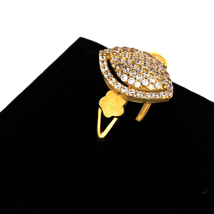 Gold ring with diamond accents on a black background