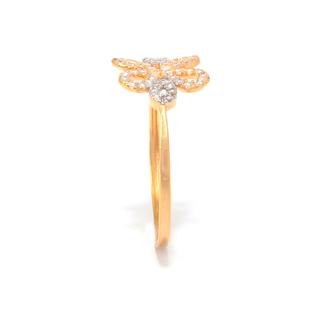 Gold ring with diamond accents on a white background