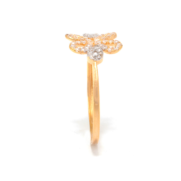 Gold ring with diamond accents on a white background