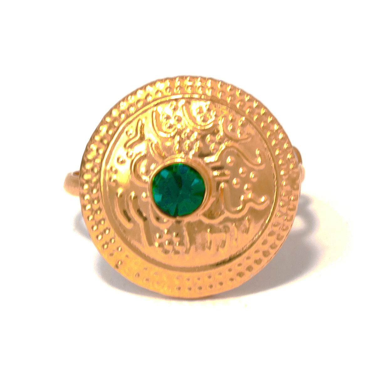 Gold ring with a green gemstone on a white background