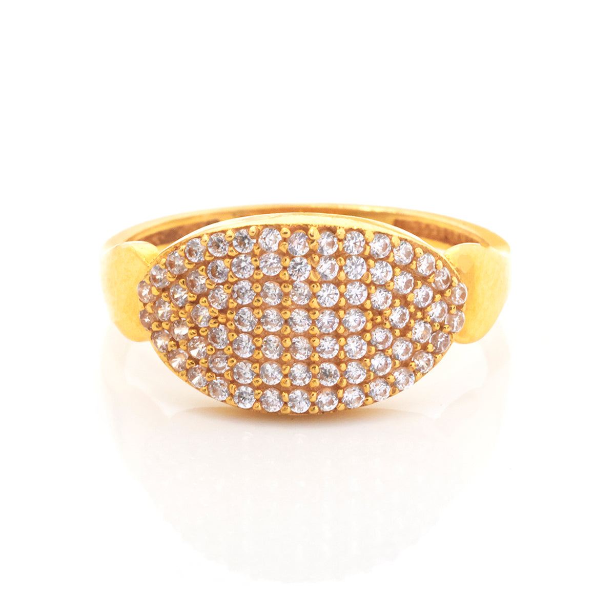 A yellow gold ring featuring an oval pavé-set diamond face, photographed on a clean white background with a soft reflection.