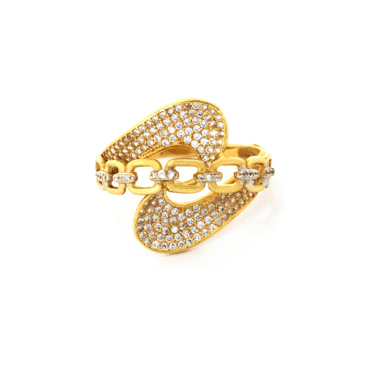 Gold bracelet with chain design and clear stones on a white background