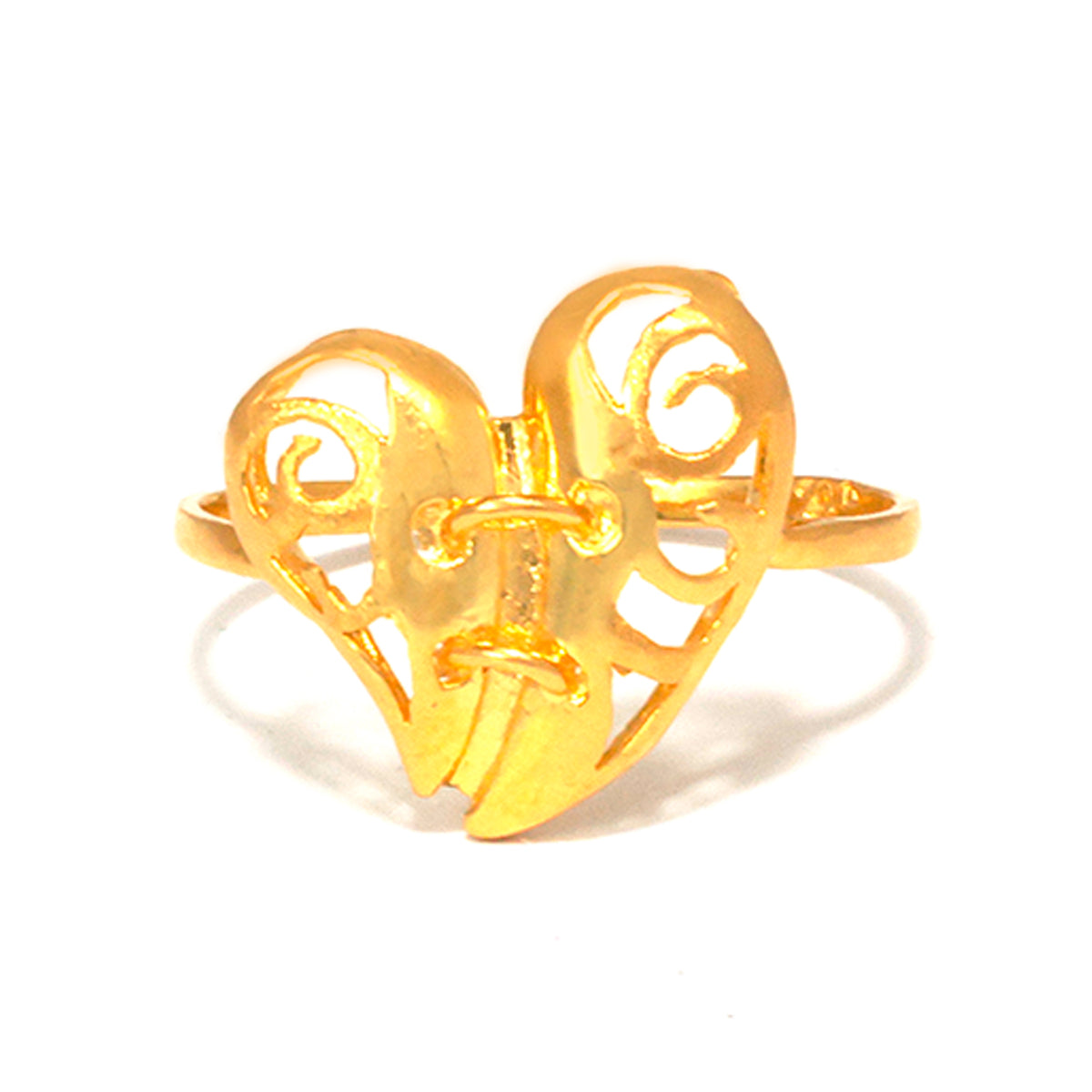 Gold ring with intricate design on a white background