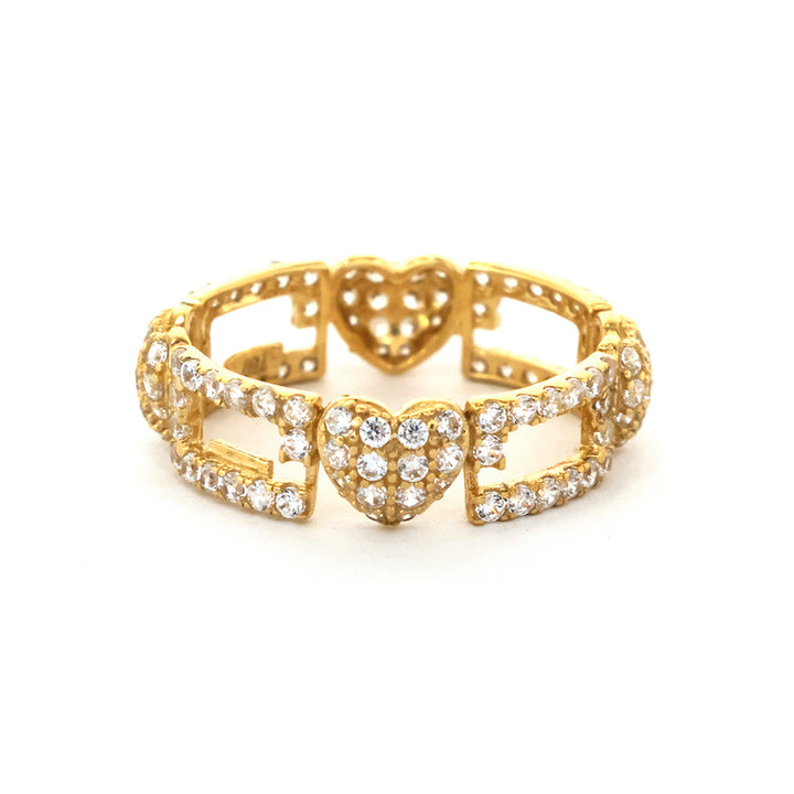 Gold ring with heart designs and clear stones on a white background