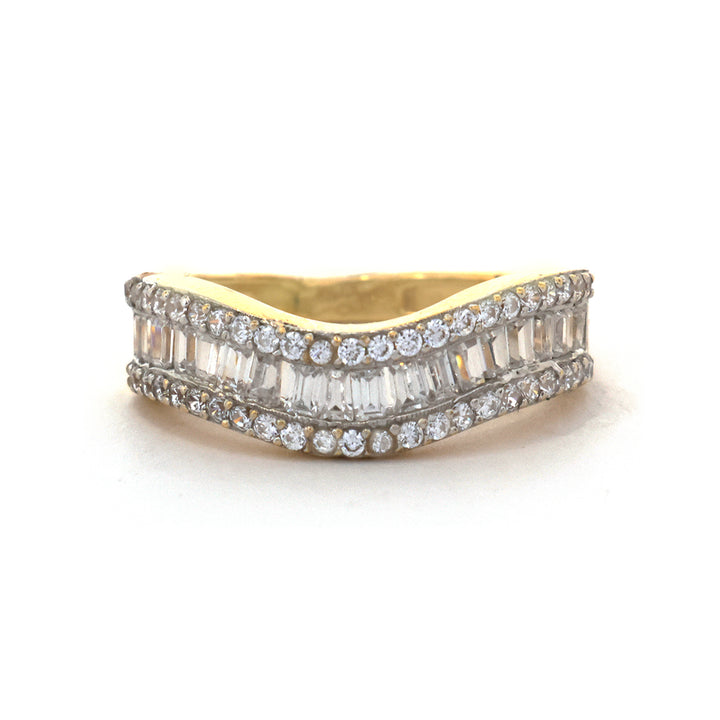 Gold ring with diamond accents on a white background