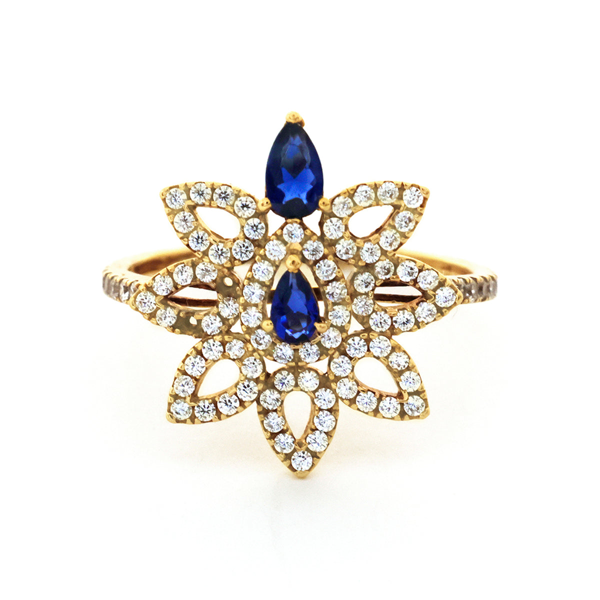 Gold ring with blue gemstones on a white background