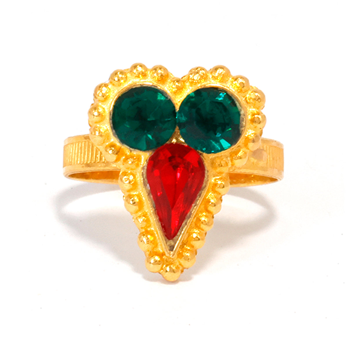Heart-shaped ring with gold frame, green and red gemstones on a white background