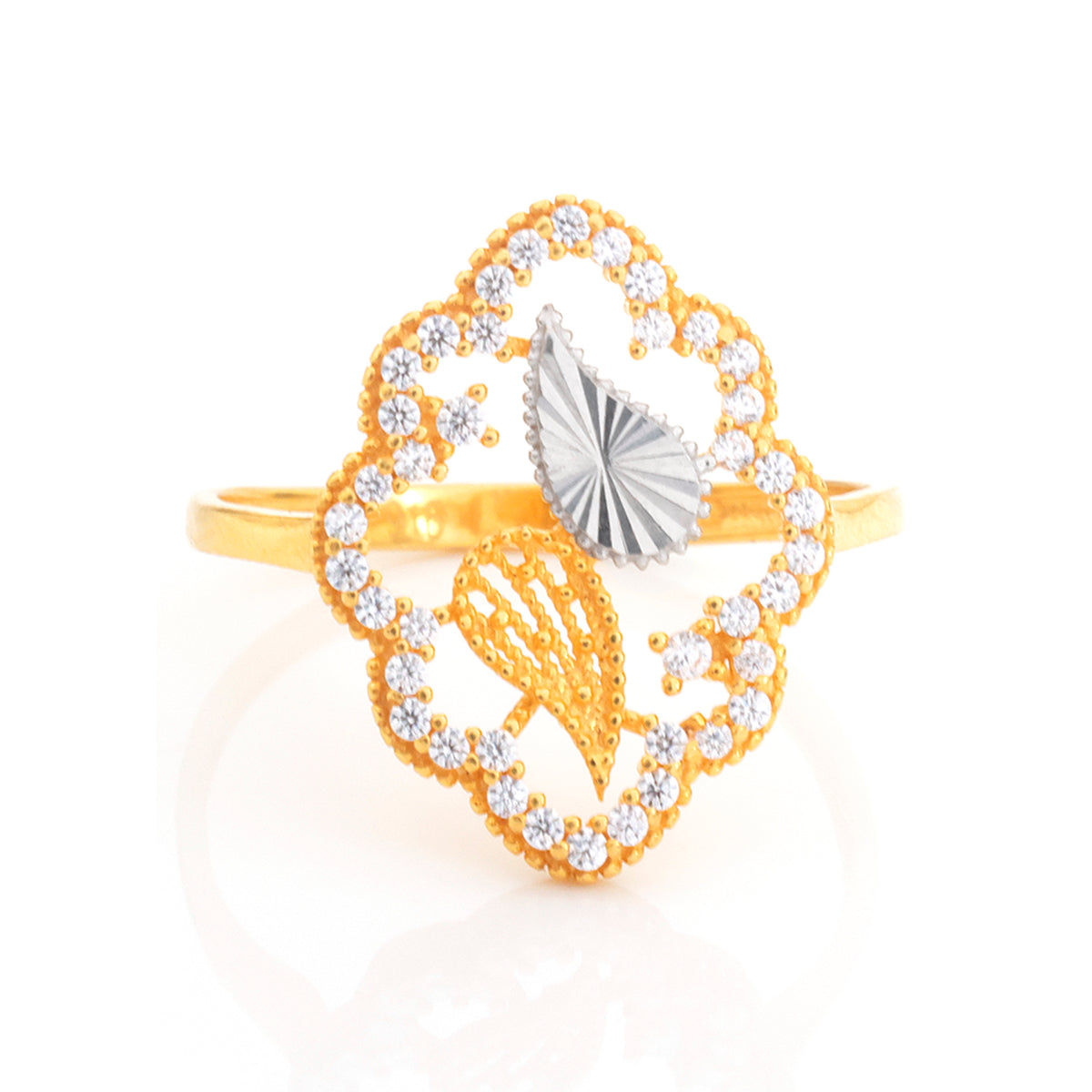 A gold ring featuring a decorative quatrefoil-shaped setting with small clear stones, a gold leaf motif, and a central silver-toned fan-shaped element on a white background.