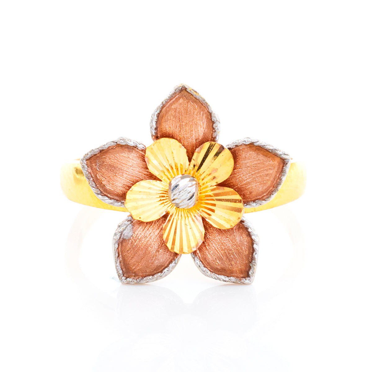 Floral-shaped ring with gold and silver design on a white background