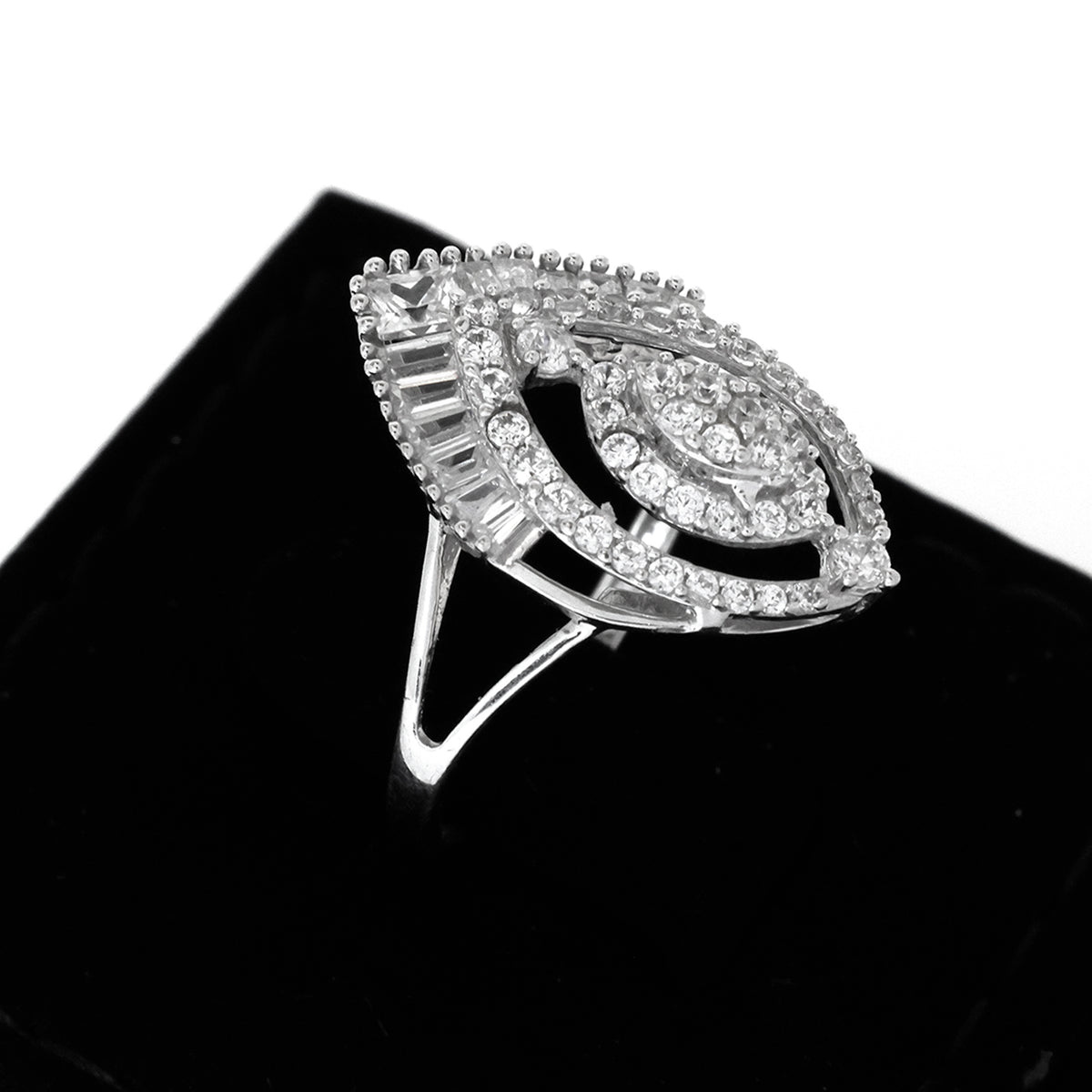 Silver ring with gemstones on a black background