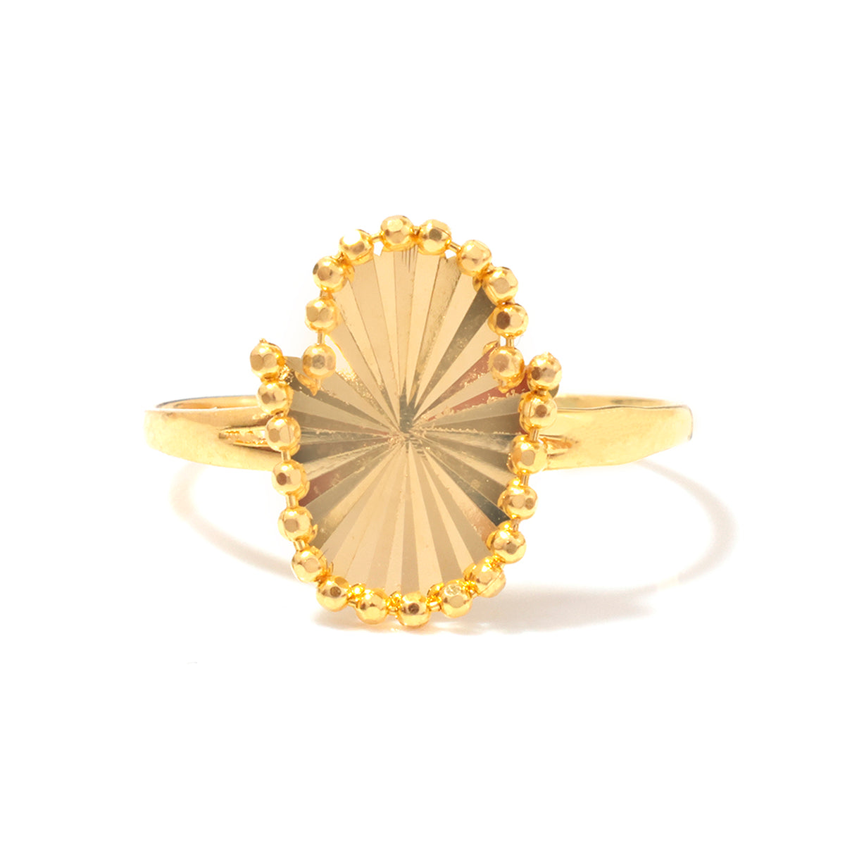 A gold ring featuring a large, oval-shaped sunburst center stone with a beaded border, set on a polished gold band, photographed against a clean white background.